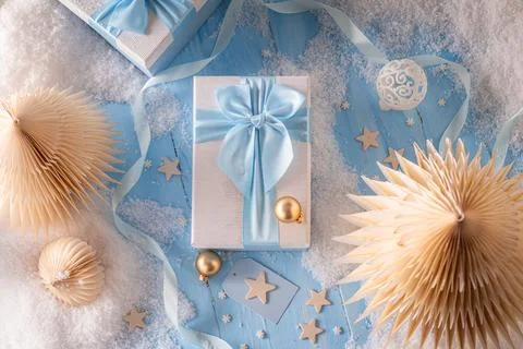 Blue present package with traditional festive decorations. Stock Photos