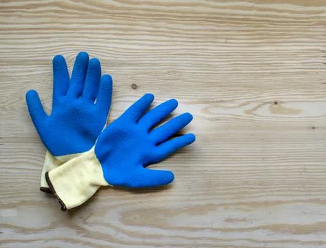 Blue protective rubber gloves for construction and operation with caustic Stock Photos