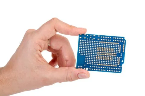Blue prototyping pcb in a hand Stock Photos