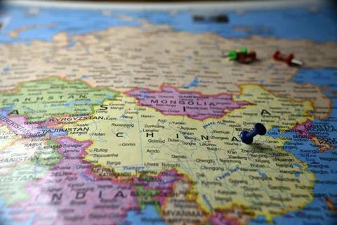 Blue Push Pin Marking China on Blurred World Map Macro Close Up Travel Loca.. Stock Photos