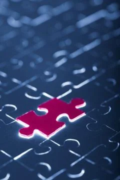 Blue puzzle with one red piece Stock Photos