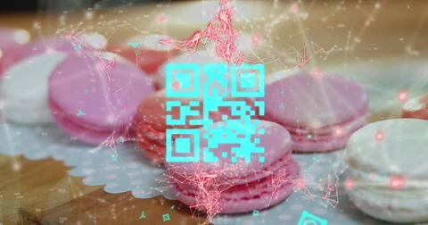 Blue QR code with a red floating web of connections over pink macaronies lying Stock Photos