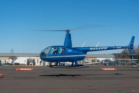 Blue R44 taking off Stock Photos