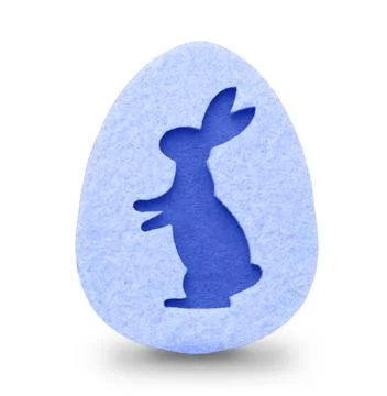 Blue rabbit silhouette on a blue Easter felt egg insulated on white Stock Photos