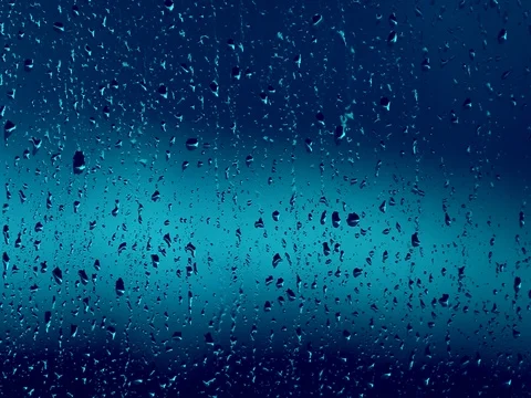 Blue rain drops on window Stock Footage 76677676