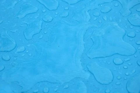 Blue rain puddles Stock Photos