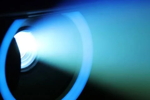 Blue rays of light through the smoke from the projector. Lighting equipment.  Stock Photos