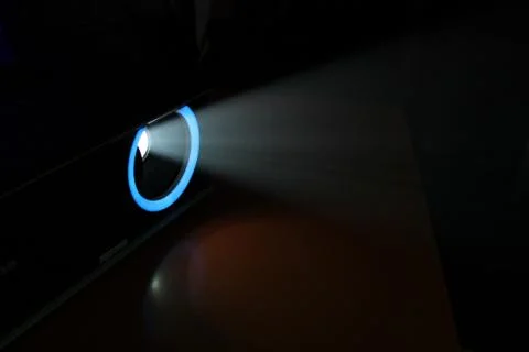 Blue rays of light through the smoke from the projector. Lighting equipment.  Stock Photos