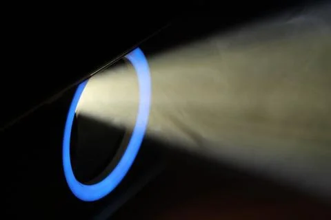 Blue rays of light through the smoke from the projector. Lighting equipment.  Stock Photos