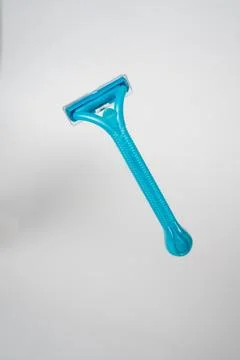 Blue Razor on White Background Stock Photos