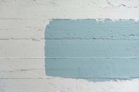 Blue rectangle painted on white concrete wall abstract background with copy.. Stock Photos