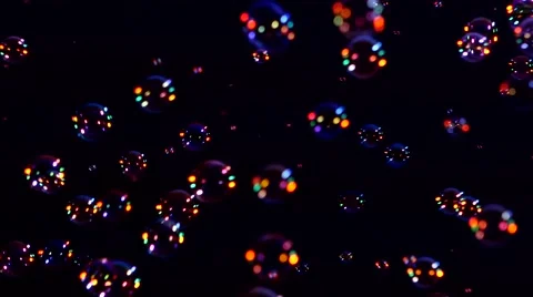 Blue, red and orange soap bubbles on black, background, close up Stock Footage 53018166