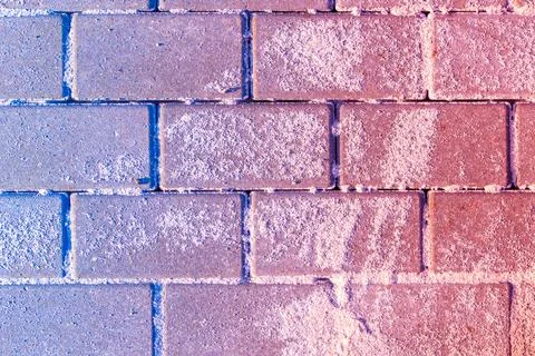 Blue to red gradient superimposed on sanded paving slabs Stock Photos