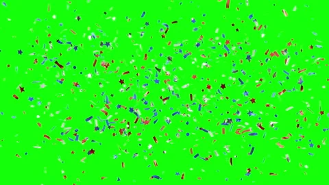 Blue red white confetti of various shapes explode on a green background. Stock Footage 155332309