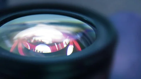 Blue Reflection in Lens Glass Stock Footage 77570719