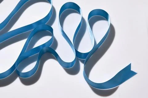 Blue ribbon on white background Foto stock