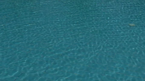 Blue Rippling Reflections. Serene Pool Water With Sparkling Ripples And Stock Footage 337939427