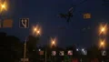 Blue road signs on night city street, traffic rules compliance, urban area HD Footage