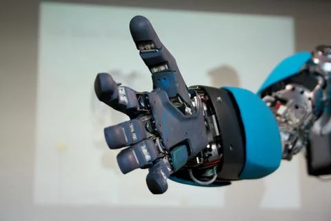 Blue robot hand will greet gloseup Stock Photos