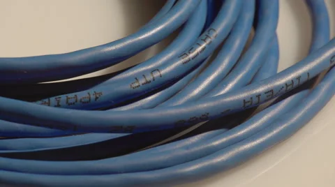 A blue rolled computer cable Stock Footage 60056563