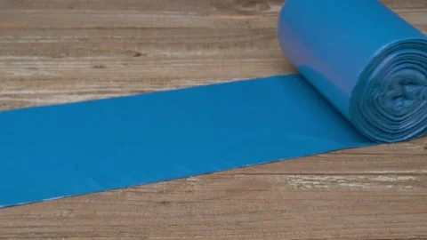 Blue Rolled Exercise Mat is elegantly displayed on a Rustic Wooden Background Stock Footage 291287133