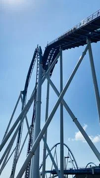 Blue roller coaster twists and climbs at Cedar Point , Ohio amusement park .. Stock Photos