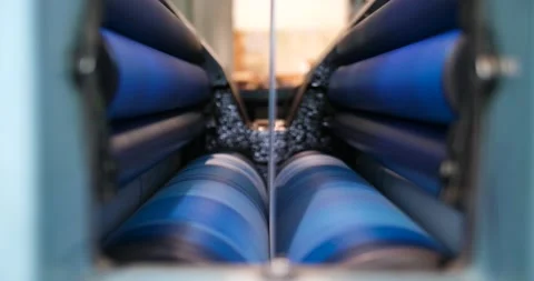 Blue rollers in a symmetrical arrangement rolling in a print machine Stock Footage 155786233