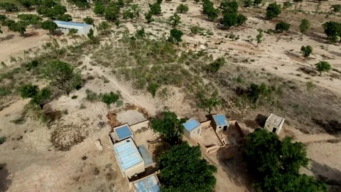 Blue roof houses along road to Ouaga Stock Footage