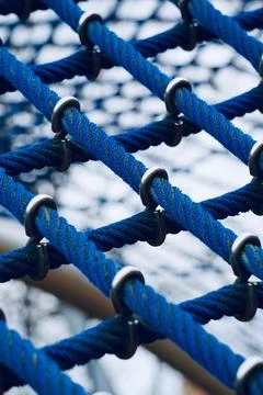 Blue rope net in the playground Stock Photos