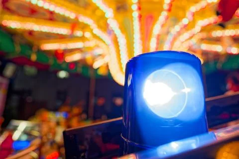 Blue rotating light at Schleswig Christmas market with festive fairground l.. Stock Photos