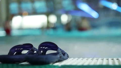 Blue rubber slap on the edge of the pool in the Stock Footage 299644259