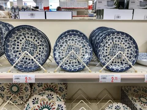 Blue rustic pattern ceramic plates on shelves Stock Photos