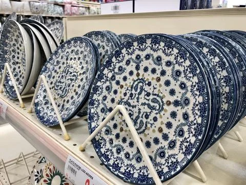 Blue rustic pattern ceramic plates on shelves Stock Photos