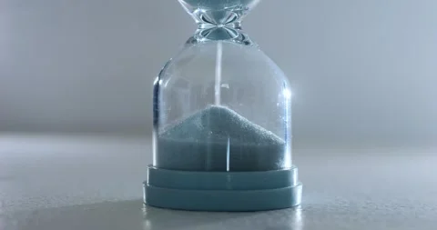 Blue sand hourglass bottom forms mound, time flies. scene serves as powerful Stock Footage 312744699