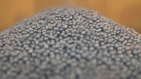 Blue sand pouring close up Stock Footage 145584649
