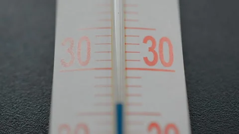 Blue scale on the thermometer on black b... | Stock Video | Pond5