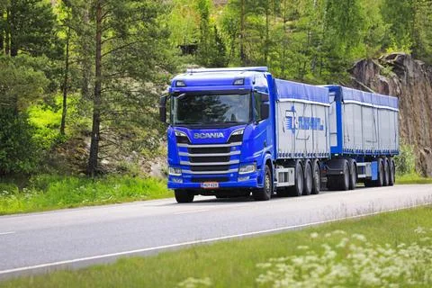 Blue Scania R650 Truck Bulk Commodity Transport Trailer on Road Blue Scani... Stock Photos