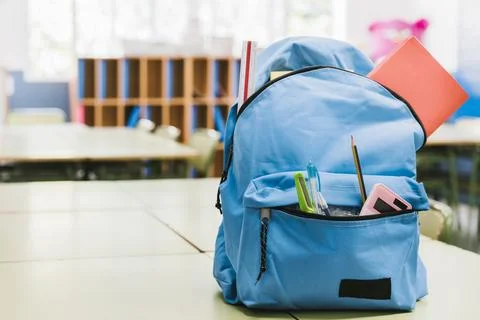 Blue schoolchild backpack table. High quality beautiful photo concept Stock Photos
