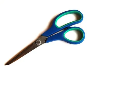 Blue scissors on a white isolated background. Place for text. Foto stock