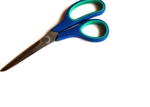Blue scissors on a white isolated background. Place for text. Stock Photos