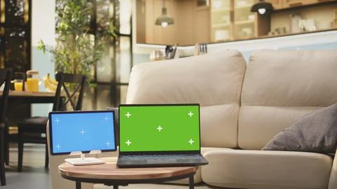 Blue screen and green screen mockup on coffee table in living room Stock Photos