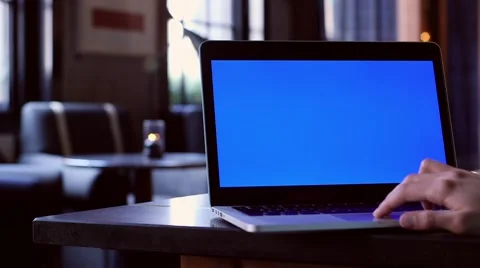 Blue screen evening at bar macbook Stock Footage 63392081
