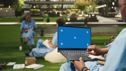 Blue screen laptop chroma key held by medical student using touchpad 스톡 동영상 340962819