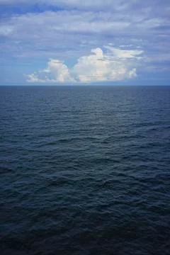 Blue sea and clouds Stock Photos