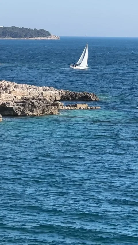 Blue sea background, small boat Stock Footage 240636875