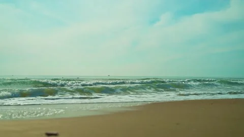 Blue sea with beach view on yellow sandy beach Stock Footage 239545914