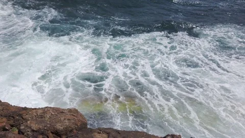 Blue sea. Big waves with white foam. Rocky seashore. Summer vacation concept Stock Footage 137958862