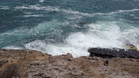 Blue sea. Big waves with white foam. Rocky seashore. Summer vacation concept Stock Footage 137958863