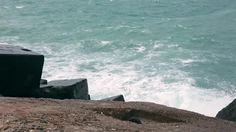 Blue sea. Big waves with white foam. Rocky seashore. Summer vacation concept Stock Footage 137958876