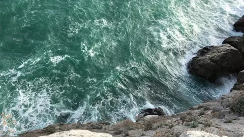Blue sea at the cliffs from a great height Stock Footage 131615673